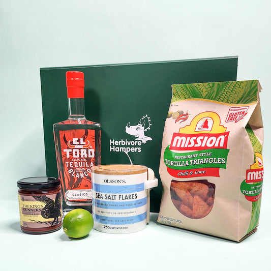 vegan Mexican themed gift items in front of a green hamper box