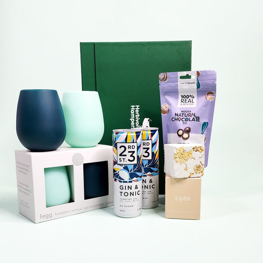 vegan hamper items in front of a green hamper box