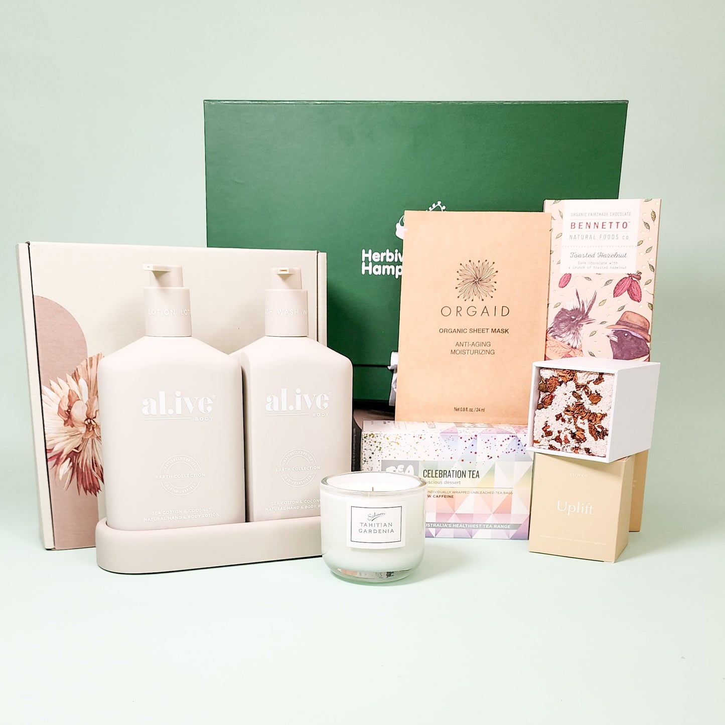 tea time hamper items in front of green hamper box
