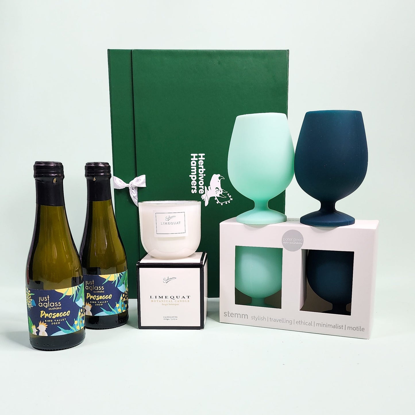 vegan gift items in front of green hamper box